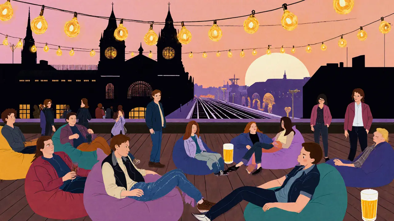 Casual guests relaxing on beanbags at The Standard&#039;s rooftop at sunset.