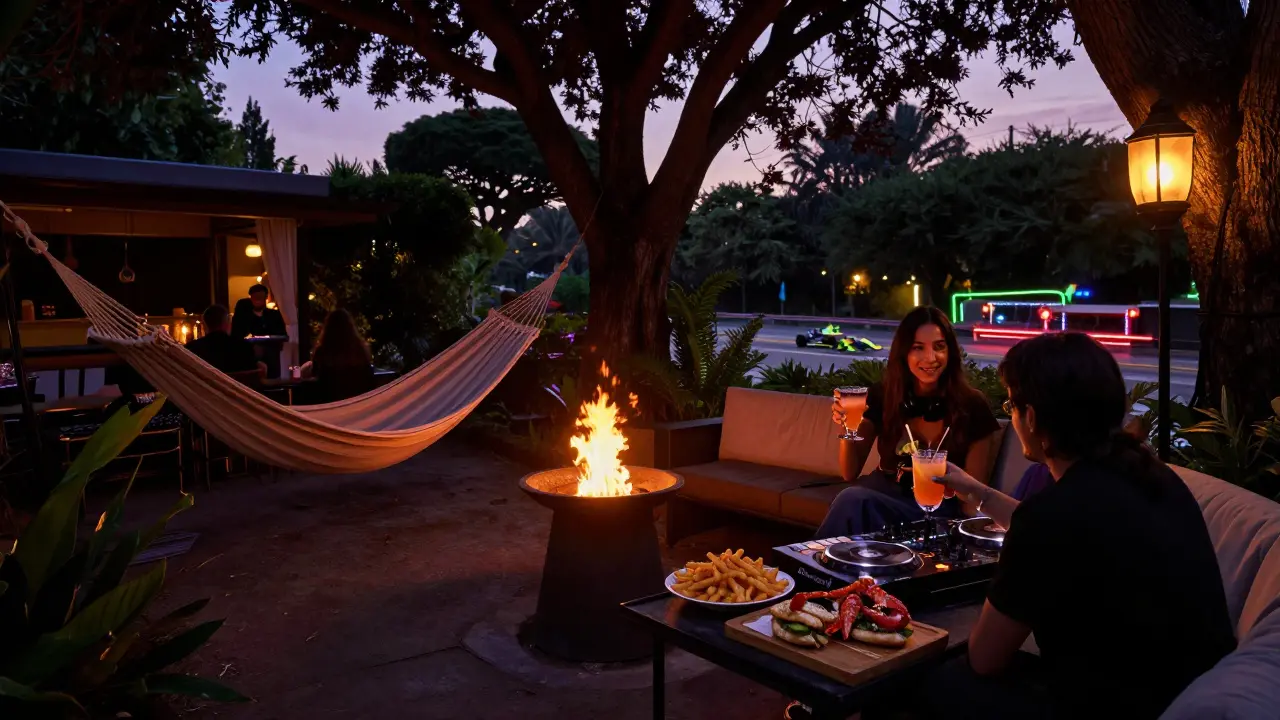 A garden nightclub at dawn, with fire pits, hammocks, and soft lighting as the Formula 1 circuit glows faintly in the distance.