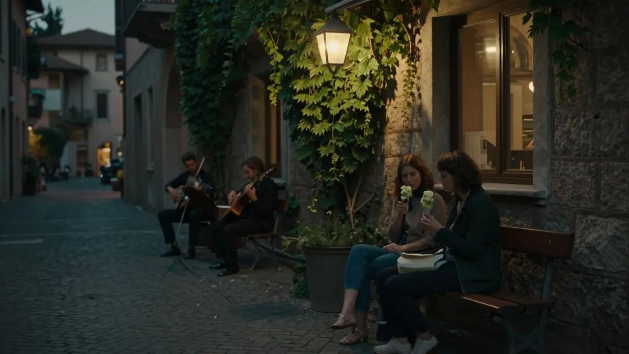 Two people sharing gelato on a quiet Brera bench under a lantern as musicians play nearby.